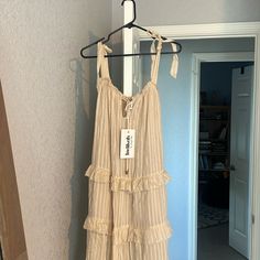 Us Size Xs. Nwt Paid $100, Asking $20. Crwam Nudes Color. Never Worn Beige Summer Maxi Dress With Ruffles, Summer Cream Maxi Dress With Ruffles, Beige Maxi Dress With Ruffle Hem For Day Out, Beige Tiered Midi Dress With Ruffles, Beige Tiered Ruffle Midi Dress, Sleeveless Beige Maxi Dress With Ruffle Hem, Cream Ruffled Sundress For The Beach, Tiered Ruffle Hem Dresses For Daytime, Daytime Tiered Dress With Ruffle Hem