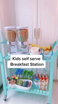 kids self serve breakfast station with cereals, fruit and drinks on the side table