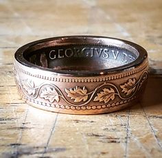 This is a Canadian 1900's to 1910's Copper Large Cent that has been crafted into a Coin Ring. It is presently a size 6, but it can be resized up to a size 9 and down to a size 4. Please be sure to let me know which size you would like. Victorian Engraved Ring With Decorative Band For Anniversary, Antique Engraved Ring With Decorative Band For Anniversary, Victorian Engraved Ring For Formal Occasions, Antique Engraved Ring With Decorative Band, Victorian Etched Rings For Anniversary, Vintage Engraved Ring With Historical Design, Antique Etched Engraved Round Ring, Antique Stamped Collectible Rings, Vintage Hallmarked Engraved Ring For Anniversary