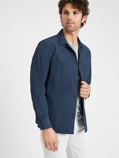 WATER-REPELLENT: A modern mix of nylon and cotton with a crinkled texture, this fabric is also great in the rain.  WARM: Unlined and perfect for layering.  Point collar.  Snap front closure.  Side and chest pockets.  Unlined.  Standard fit.  Long sleeves.  Hits at the hip.  Center back length (size M): Regular 28. 5", Tall 30" Sleeve length: Regular 35", Tall 36. 5" Model: Size M, 6'2" (188cm).  Water Repellent Spring Casual Outerwear With Functional Buttons, Casual Spring Outerwear With Functional Buttons, Casual Long Sleeve Windbreaker For Layering, Spring Nylon Tops With Pockets, Everyday Windbreaker With Pockets, Everyday Long Sleeve Windbreaker With Pockets, Everyday Spring Nylon Outerwear, Fall Nylon Tops With Pockets, In The Rain