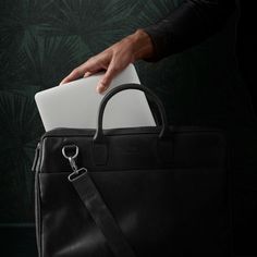 Get not one, but two large interior compartments with the Montreal double zip bag for men. One side has a protective padded laptop pocket, while the other has compartments for other stuff like books, papers, pens, etc. Encloses with strong YKK zippers. The exterior has a large pocket, two padded handles, and an adjustable, detachable shoulder strap. Made with durable buffalo leather that improves with wear and tear. A Danish design by the Lucleon brand. Functional Satchel Laptop Bag With Sleeve, Functional Laptop Bag Satchel With Sleeve, Business Laptop Bag Satchel With Zipper Pocket, Black Laptop Bag With Zipper Pocket For Office, Functional Briefcase With Laptop Sleeve For Everyday Use, Black Business Briefcase With Zipper Pocket, Classic Black Laptop Bag With Zipper Pocket, Black Briefcase With Zipper Pocket For Business, Business Laptop Bag With Zipper Pocket