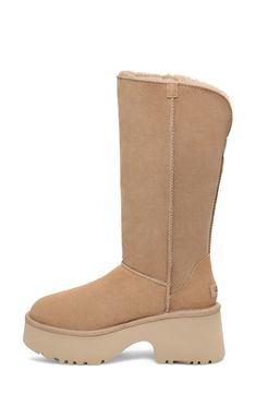 A tall shaft lined with genuine shearling folds down to double the styling options of a boot that's made of soft suede and kicked up on a lightweight foam sole. The foot is lined with cushy, warm UGGplush, a moisture-wicking textile made from a wool-rich blend but crafted to feel and wear like genuine shearling. 3 3/4" heel; 2 1/2" platform (size 11) 13" shaft; 17" calf circumference Pull-on style Leather and genuine shearling upper/wool-blend lining/synthetic sole Shearling may be sourced from Classic Sheepskin Boots With Suede Lining, Classic Boots With Sheepskin And Suede Lining, Hair Care Gifts, Oxford Heels, Walker Shoes, Platform Slippers, Jo Malone London, Ugg Classic, Fabric Gift Bags