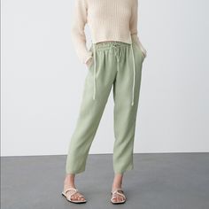 High-Waist Trousers With An Elastic Waistband And An Adjustable Drawstring. Front Pockets, Decorative Welt Pocket At The Back. Light Khaki . Full Waist 26” And Beyond.Length 38” Inseam 27” Rise 11” Green Pull-on Pants For Loungewear, Green Pull-on Straight Pants, Green Casual Pull-on Bottoms, Green Tapered Leg Pants With Pull-on Style, Spring Sweatpants With Drawstring, Spring Workwear Pants With Pull-on Style, Versatile Drawstring Pants For Fall, Drawstring Bottoms For Workwear In Fall, Trendy Bottoms With Elastic Cuffs For Spring