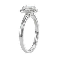 You'll adore the sleek style of this 14k white gold moissanite emerald-cut halo ring. RING DETAILS Width: 9.2 mm. Metal: rhodium-plated 14k white gold Includes: gift box & warranty card By Charles & Colvard  STONE DETAILS Stone type: lab-created moissanite Total weight diamond equivalent: 5/8 ct. Cut:emerald Setting: prong  Diamond equivalent carat (ct.) Total Weight (T.W.) represents the approximate total weight of diamonds of equivalent appearance.Please note, due to the high value of this ite White Emerald Cut Moissanite Halo Ring, Silver Halo Ring With Radiant Cut, White Asscher Cut Halo Ring, White Radiant Cut Diamond Ring With Halo Setting, Silver Emerald Cut Diamond Ring With Halo, Silver Radiant Cut Halo Ring, Asscher Cut Halo Diamond Ring For Formal Occasions, Formal White Radiant Cut Halo Ring, White Asscher Cut Halo Ring With Prong Setting