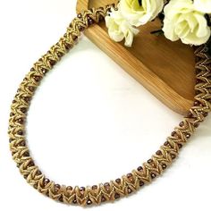 "Elegant and fancy beige and gold statement necklace. This handmade special necklace is feminine and impressive for evening parties or other special occasions. It is also a perfect gift to your wife or someone you love. I created this beautiful beige and gold necklace by hand, using Miyuki round seed beads and Czech beads. Closing is by gold-plated brass lobster claw clasp. ♦ 𝗠𝗘𝗔𝗦𝗨𝗥𝗘𝗠𝗘𝗡𝗧𝗦 ♦ Total length necklace: 18.11'' (46 cm) Total Width: 0.59\" (1.5 cm) ♦ 𝗨𝗽𝗴𝗿𝗮𝗱𝗲 𝘆𝗼𝘂𝗿 𝗷𝗲𝘄𝗲𝗹𝗿𝘆 𝗰𝗼𝗹𝗹𝗲𝗰𝘁𝗶𝗼𝗻 𝘄𝗶𝘁𝗵 𝘁𝗵𝗲𝘀𝗲 𝗯𝗲𝗮𝘂𝘁𝗶𝗳𝘂𝗹 𝗻𝗲𝗰𝗸𝗹𝗮𝗰𝗲 ♦ ♦ 𝗧𝗵𝗼𝘂𝗴𝗵𝘁𝗳𝘂𝗹𝗹𝘆 𝗽𝗮𝗰𝗸𝗮𝗴𝗲𝗱 𝗶𝗻 𝗮 𝗴𝗶𝗳𝘁 𝗯𝗼𝘅 ✧ For more statement necklaces click here: https://www.etsy.com/il-en/shop/liorajewelry?section_id=19063257 Back to my shop: https://www.e Brown Gold Beads Jewelry For Party, Elegant Brown Jewelry With Gold Beads, Handmade Brown Beaded Necklaces For Party, Handmade Brown Party Beads, Gold Beads For Long Necklace Party, Brown Beaded Necklace With Gold Beads For Party, Beige Beaded Necklace With Gold Round Beads, Elegant Brown Necklace With Gold Beads, Elegant Brown Necklaces With Gold Beads