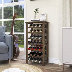 a living room filled with furniture and a guitar on the floor next to a window