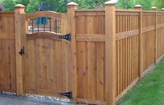 a wooden fence with the words take a look 4 ft yard fence on top of it