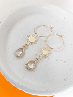 Our Gold Hoop Sundrop Earrings are designed to add the finishing touch to brides, bridesmaids or the simple Little Black Dress. These boho style earrings are hand assembled, gold filled,  and hypoallergenic. *For wholesale/bridal party orders, please message me for discounted pricing * *Lightweight & Hypoallergenic *Slow made to ensure quality EARRING CARE: Earrings are gold filled but may tarnish if exposed to frequent moisture.  Apply all moisturizers and makeup before putting on earrings. Store in a cool, dry place when not wearing. Gold Jewelry For Wedding, Gifts For Bridal Party, Earrings For Bridesmaids, Bridal Party Earrings, Jewelry For Wedding, Sun Earrings, Boho Style Earrings, Party Earrings, Earrings Boho