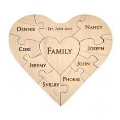 a heart shaped puzzle with the names of family on it and two hearts in each