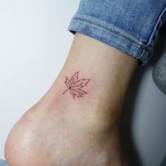 a small leaf tattoo on the ankle