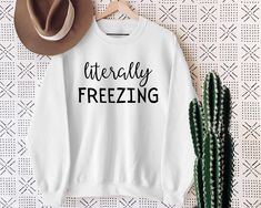 Get cozy this season with our "Sweater Weather" Women Sweatshirt, perfect for those who are "Always Cold." This Trendy Sweatshirt features a humorous "Freaking Freezing" slogan, making it a fun addition to your loungewear collection. Ideal as an Autumn Sweatshirt or Holiday Sweatshirt, it's a Cute Christmas Tee and a Chic Women Sweater all in one. Give the gift of warmth with this Funny Sayings Tee, a perfect Christmas gift for your loved ones! Welcome to NIOBE BOUTIQUE. I am happy to see you in Cricut Hoodie Ideas Women, Iron On Sweatshirt Ideas, Sarcastic Sweatshirts, Funny Christmas Sweatshirts, Weather Women, Slogan Making, Always Cold, Sweatshirts Quotes, Ugly Christmas Sweater Party