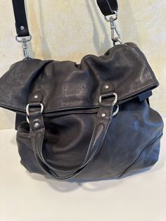 Brand new. Very unusual and cute. Soft leather, has ribbons on sides. New $168. Need to cut security tag out before using, inside seam is location. Hobo Shoulder Bag With Gunmetal Hardware For Shopping, Brown Shoulder Bag With Gunmetal Hardware For Shopping, Crossbody Hobo Bag With Gunmetal Hardware For On-the-go, Crossbody Hobo Bag With Gunmetal Hardware, Travel Shoulder Pouch Bag With Gunmetal Hardware, Travel Pouch Shoulder Bag With Gunmetal Hardware, Top Handle Satchel With Gunmetal Hardware, Top Handle Hobo Bag With Gunmetal Hardware, Shopping Crossbody Shoulder Bag With Gunmetal Hardware