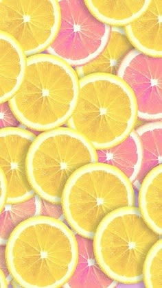 many slices of lemons are arranged in a pattern on a pink and yellow background