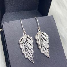 Exquisitely Hand Crafted Silver Filigree Leaf Earrings. Beautiful And Unique. Intrinsic Details Throughout. Brand New. Total Weight 4.1 G Of 925 Silver. Price Is Firm. Sterling Silver Leaf-shaped Earrings, Elegant Sterling Silver Leaf-shaped Jewelry, Elegant Sterling Silver Leaf Jewelry, Elegant Leaf Shaped Earrings As Gift, Elegant Leaf-shaped Earrings For Gift, Silver Leaf-shaped Pierced Earrings, Elegant Leaf-shaped Sterling Silver Earrings, Elegant Silver Leaf Jewelry, Silver Leaf-shaped Earrings For Wedding