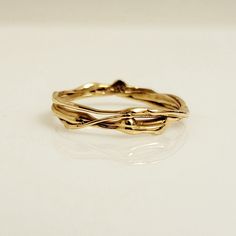 Handmade one-of-a-kind wedding band or stackable 14k yellow gold ring from the Lava Collection. The photos are taken of the exact same ring from different angles. The matching diamond engagement ring shown on the hand, can be purchased separately from the following link: https://www.etsy.com/ca/listing/1511066748/diamond-one-of-a-kind-ring-organic-ring DETAILS:  - Solid 14k yellow gold  - Ring size 8 - SKU: EK40104 -*The diamond engagement ring is not included. CUSTOM ORDER:  A ring similar to t Organic Rings Engagement, Molten Gold, Handmade Wedding Rings, Bespoke Rings, Organic Rings, Organic Ring, Stackable Ring, Handmade Wedding, Stackable Rings