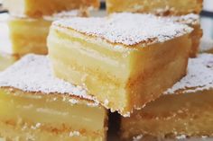 several pieces of cake sitting on top of a plate with powdered sugar toppings