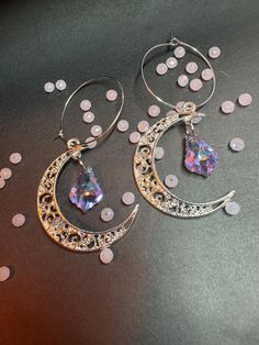 A pair of silver-colored half-moon earrings with iridescent glass crystal Price is per pair of earrings! If you have any questions, please write to me <3 Half Moon Earrings, Moon Earrings, Glass Crystal, Half Moon, Crystal Glass, Silver Color, Jewelry Earrings Dangle, Dangle Earrings, Jewelry Earrings