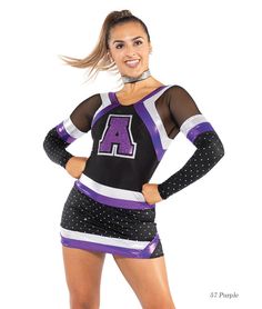 a woman in a purple and black cheerleader uniform posing for the camera with her hands on her hips