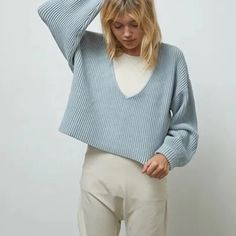 With A Thick Cuff, Blouson Sleeve, And Oversized Fit, This Pullover Hangs Just Right No Matter What You Pair It With. Reversible For Two Different Looks (V-Neck Or V-Back), Wear It Over A Bodysuit, Or Off The Shoulder The Possibilities Are Endless. Composition: 65% Organic Cotton, 24% Nylon, 10% Silk, 11% Elastane Brand New In Plastic Packaging. Blue V-neck Tops With Ribbed Cuffs, Blue Cropped Sweater With Ribbed Cuffs For Fall, Blue Ribbed Cropped Sweater For Fall, Fall Blue Ribbed Cropped Sweater, Oversized Blue Cropped Sweater For Winter, Light Blue Sweater For Winter Layering, Oversized Blue Cropped Sweater, Blue Ribbed Long Sleeve Cropped Sweater, Chic Blue Cropped Sweater For Fall