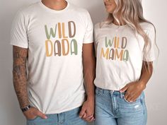 a man and woman standing next to each other wearing t - shirts with the words wild dad and mama printed on them