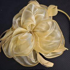 So Feminine And Pretty! Beautiful Fascinator Ribbon Large Bow! Adorned With Delicate Feathers, A Lace Veil, And Set On A Comfortable Headband Or Clip. This 3 Piece Exquisite Accessory Is Perfect For Derbys, Equine Events, Weddings, Receptions, Brunch, Tea And Garden. Parties, And Other Special Occasions. Elevate Your Look And Exude Timeless Charm With This Must-Have Accessory. Buy It Now And Embrace The Allure Of Classic Sophistication!" Please Note* The C Olor For This One Is Gold. Elegant Gold Hair Accessories For Spring, Elegant Yellow Headband Fascinator, Elegant Yellow Evening Fascinator, Elegant Yellow Headband For Wedding, Elegant Yellow Headpiece For Party, Elegant Fitted Yellow Headpieces, Elegant Gold Summer Headband, Elegant Yellow Headband For Party, Elegant Yellow Party Headband