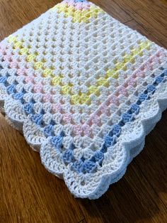 a crocheted dishcloth on a wooden table