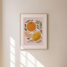 an orange print hangs on the wall next to a window