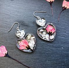 Cherry Blossom Double Hearts Handmade Clear Earrings These impressive earrings perfectly add a pretty finishing touch to any outfit and they are sure to make you look good and feel good. The earrings are delicately handmade one by one, real pressed flowers preserved in clear resin. You can choose to write your name (max. 5 English characters) at the back of the earrings, please specify in the personalization box. If you purchase with gifting purpose, we also have a tailor-made Dried Flower Gift Silver Flower Earrings For Valentine's Day, Pressed Flower Resin, English Characters, Hearts Earrings, Pressed Flower Crafts, Clear Earrings, Flower Resin, Polish Silver, Double Heart