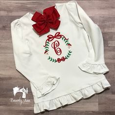 Thank you for visiting My Beverly Ann Boutique! This listing is for a Santa frame monogram shirt. It can be personalized with your child's initial. As always, personalization is always FREE. Please list the child's initial in the personalization section. This shirt is perfect for your little princess to wear throughout the holiday season. The bodysuits I use snap up the back. Please see size charts for measurements. Machine wash in cold water and hang to dry. Iron on medium heat on the wrong sid Cute Christmas Shirts Vinyl Monogram, Christmas Shirt Monogram, Christmas Tshirts Vinyl Monogram, Kids Christmas Embroidery Shirts, Christmas Monogram Shirt Kids, Christmas Monogram Shirt, Framed Initials, Monogram Shirt, Girls Holiday