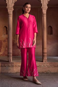 Fuchsia pink three fourth sleeves short kurta with petal swirl embroidery using cut dana, sequins highlights and frilled V neckline. Paired with an embellished border straight pant and scallop border peach dupatta. - Aza Fashions Pink Sequined Kurta For Festivals, Pink Sequined Kurta For Party, Pink Party Kurta With Sequins, Pink Sequined Party Kurta, Bollywood Style Pink Kurta With Sequins, Embellished Pink Palazzo Set For Diwali, Pink Embellished Palazzo Set For Diwali, Pink Embellished Straight Kurta Set, Pink Silk Embellished Kurta