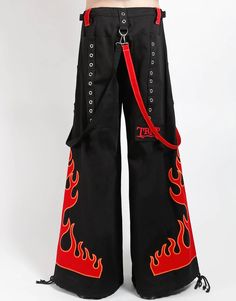 Dark Street pant in black with removable straps, adjustable ankles, D-rings, and deep pockets with embroidered flames on sides. WOMAN IS WEARING X-SMALLMAN IS WEARING MEDIUMSIZING BASED ON MENS FIT– Refer to Unisex Darkstreet Pant - Size Chart (Based on Men's Sizing)– Drawstring and adjustable waist buckles allow for a tighter fit on the waist– 100% Cotton.– Hand wash cold. Lay flat to dry. Embroidered Flames, Flame Pants, Fire Pants, Tripp Pants, Embroidery Pants, Gender Fluid Fashion, Strap Pants, Dark Street, Alt Outfits