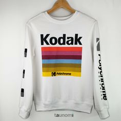 new + preloved.   apparel + sundries.    everyday + life. Kodak Polychrome Graphics Sweatshirt Kodak Polychrome Graphics Sweatshirt Cozy lightweight sweatshirt that features colorful "Kodak Polychrome Graphics" print. Perfect for a photography enthusiast, or anyone looking to add a little color to their wardrobe. Enjoy!  Special Price: $24.95 $34 MSRP SIZE: XS MATERIAL: 60% Cotton; 40% Polyester CONDITION: New with tags. MEASUREMENTS: 36" bust; 25" length. Multicolor Cotton Sweatshirt With Logo Print, White Screen Print Band Merch Sweatshirt, Multicolor Logo Print Sweatshirt For Streetwear, Casual Rainbow Crew Neck Sweatshirt, Rainbow Cotton Crew Neck Sweatshirt, White Retro Graphic Print Sweatshirt, Multicolor Crew Neck Sweatshirt For Streetwear, Multicolor Long Sleeve Sweatshirt With Screen Print, Multicolor Sublimation Print Sweatshirt For Streetwear