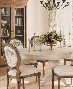 a dining room table with chairs around it