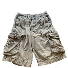 Men’s American Eagle Long Line Cargo Shorts Size 30. They Have Been Washed But They Were Never Used. They Have The Distressed Look On The Bottom. Longer Length. Tie Closure Inside And Button Closure Outside. Cargo Pockets. Shorts Men, Look On, Cargo Shorts, Mens Shorts, American Eagle Outfitters, American Eagle, That Look, Man Shop, Grey