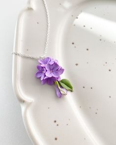 This lilac pendant is fully handmade. Each element petal is made entirely by hands from material called cold porcelain and toned with soft pastel. These flowers look much like fresh flowers but they will never fade. Size of composition - length - 1.5 inches (4 cm)                                         width - 1 inches (2,5 cm) This pendant with lilac are perfect for woodland, greenery or rustic weddings and other celebrations. But also they will be good even as casual accessory. Flowers are te Lilac Jewelry, Lilac Earrings, Lilac Wedding, Wedding Pendant, Rustic Weddings, Botanical Jewelry, Earrings Flower, Paper Jewelry, Casual Accessories