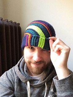 a man wearing a colorful knitted hat