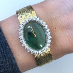 This stunning Tishman and Lipp wristwatch is crafted from 18k yellow gold and features a green dial surrounded by stunning natural diamonds. There are 1.04 carats of sparkling high quality diamonds set around the dial of the watch.  The bezel and case color also match the beautiful gold of the watch, making it an elegant and timeless piece. The solid case back adds to its durability. The watch is manual wind and the watch keeps excellent time.  AT 6.5" long, this will fit a small woman's wrist size.   This watch is pre-owned and in excellent condition, making it a great addition to any jewelry and watch collection. Metal:  Solid 18k Yellow Gold Weight: 42.40 Grams excluding movement            Diamond Bezel:  26 Natural Round Brilliant Cut Carats: 1.04 ctw Clarity: VS2 Color: G  Case Size: Yellow Gold Diamond Jewelry And Watches As Gift, Diamond Yellow Gold Jewelry As Gift, Luxury Formal Watches Stamped 14k, Luxury Formal Watches 14k Stamped, Luxury 14k Stamped Formal Watches, Luxury 14k Yellow Gold Jewelry And Watches, Yellow Gold Diamond Watch Gift, Luxury Diamond Hallmarked Watch, Yellow Gold Diamond Jewelry And Watches