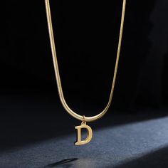 Let your style shine with this A-Z Alphabet Gold Plated Stainless Steel Pendant Necklace! Crafted of durable gold-plated stainless steel for a lasting shine, this stylish necklace will have you looking like a timeless fashionista. Make a statement today. Black Friday Jewelry, Mens Stainless Steel Rings, Letter Pendant Necklace, Initial Necklace Gold, Natural Stone Bracelets, Waterproof Jewelry, Trendy Necklaces, Mens Beaded Bracelets, Chain Choker Necklace