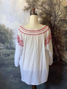 This white & red Bavarian embroidered peasant tunic is a staple in any historically inspired wardrobe, making it as versatile as it is Charming! It features intricate embroidery on the front, sleeves, and neckline, a drawstring tassel closure, and cinched tapered sleeves. This piece is part of our sustainable Secondhand, Vintage, and Upcycled Collection, and thus stock is limited to one! Sizing: No Tag, Measured to fit a size 2X-3X / XXL-XXXLBust up to 50 Inches / 130 CentimetersWaist up to 52 I Spring Folk Tunic Peasant Top, Spring Folk Peasant Tunic Top, Spring Folk Style Peasant Tunic Top, White Folk Peasant Top For Festival, Bohemian Embroidered Peasant Top For Daywear, Fitted White Folk Peasant Top, Summer Peasant Top With Embroidered Neckline, Bohemian White Peasant Top With Embroidered Sleeves, White Bohemian Peasant Top With Embroidered Sleeves