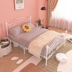 a bedroom with pink walls and white bedding has a sunflower on the pillow