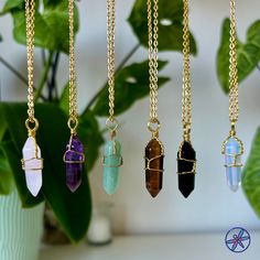 Explore our collection of crystal necklaces designed to promote well-being. Each piece is meticulously crafted to harness the special energies and benefits of these natural gems. Benefits: Amethyst - known for its ability to promote tranquility, alleviate tension and worry. Aventurine- brings luck, prosperity, and success. It promotes emotional healing, boosts the immune system, and enhances creativity and motivation. Clear quartz- can attract positive energy, support emotional healing, boost ph Holistic Gold Crystal Gemstone Necklaces, Holistic Style Gold Gemstone Crystal Necklace, Holistic Gold Gemstone Crystal Necklace, Adjustable Wire Wrapped Crystal Necklace, Spiritual Quartz Gemstone Crystals, Adjustable Gold Mineral Crystal Necklace, Adjustable Gold Crystal Necklace, Gold Crystal Necklace With Natural Stones, Amethyst Crystal Necklace For Gifts