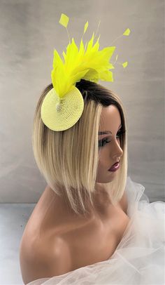 "Presenting a beautiful bright yellow/lemon feather fascinator with hand cut feathers on a straw percher/saucer base with silver beads and attached to your hair with a clearly plastic comb (please get in touch if you would like a headband adding), handmade in the UK using traditional millinery techniques to create a stunning formal piece to give that real wow factor to your outfit.   Staw base measures approximately 9.5cms in diameter. f you would like the design customising at all, or an altern Feather Crown, Yellow Feathers, Ascot Hats, Feather Fascinator, Wire Headband, Duchess Satin, Feather Fascinators, Brown Satin, Turbans