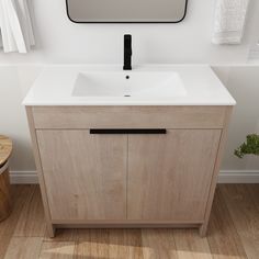 a bathroom with a sink, mirror and wooden flooring in front of the wall