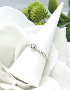 This beautiful and dainty solid sterling silver ring will be created with your loved one's ashes. the cremation round "stone" is a small 3mm and the ring band is a sturdy 1.7mm wide. *All the pieces in my cremation collection have a finished look that resemble glass or stone once set. I do make these pieces with the ashes visible, however you can specify in a note to me if you would prefer not to see the ashes. I take great care in creating these special keepsakes and I can assure you that all c Everyday Silver Stackable Solitaire Rings, Everyday Silver Solitaire Stackable Rings, Silver Birthstone Ring With Single Diamond For Gift, Silver Sterling Birthstone Ring With Diamond, Minimalist Silver Promise Ring With Birthstone, Minimalist Silver Promise Birthstone Ring, Silver Birthstone Ring With Bezel Setting For Everyday, Silver Everyday Birthstone Ring With Bezel Setting, Promise Stackable Rings With Bezel Setting