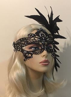 "Black Lace Masquerade Mask with Feathers and Crystals, Women's Lace Mask, Masked Ball, Wedding Masquerade Masks, Bridal Wedding Mask Beware of cheap imitations that use glue! This is an original design by IceGreenEyes. Stiffened and lace mask will not sweat your face like the cheap plastic ones. The mask is also shaped so you have lots of room around the eyes instead of a skinny slice. These masks are hand stitched, not held together with sticky glue that will heat up and fall apart before the Black Masquerade Mask For Halloween Wedding, Black Masquerade Mask For Wedding Carnival, Elegant Wedding Masks, Wedding Masquerade Mask With Rhinestones, Elegant Black Formal Mask, Fitted Black Headpiece For Masquerade, Carnival Rhinestone Masquerade Mask, Elegant Fitted Masquerade Mask For Carnival, Elegant Adjustable Masquerade Mask For Wedding