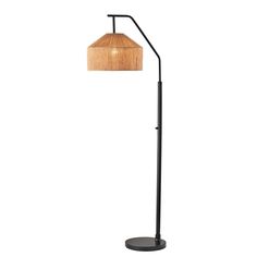 a floor lamp with a wooden shade on the top and bottom, in black metal