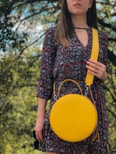 A round tote  bag  with a handle will help to emphasize your femininity, it will always effectively emphasize your image and will help to free your hands from the little things that always clutter up your pockets.The leather work tote bag not only complements your style, but also becomes a roomy bag for every day, work or walk.The yellow color of the skin, the quality of work, the silhouette of the bag are created for a true connoisseur of beauty.Product information: * soft Italian leather * ski Shoulder Bag With Detachable Handle For Daily Use, Round Case Bag With Detachable Handle, Chic Round Case Shoulder Bag With Detachable Handle, Round Shoulder Bag For Travel, Detachable Handle Round Case Shoulder Bag, On-the-go Satchel With Round Handle, Satchel With Round Handle For Daily Use, Daily Use Shoulder Bag With Round Handle, Chic Round Bags For Daily Use