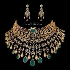 an elaborate necklace and earring set with pearls, emerald stones and gold - plated metal