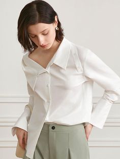 This is a modern and feminine top by yyiam that is made out of high quality and sturdy fabric. With unique design detail and trendy mood, you can style it for your clean and casual daily outfit.- Buttons detail on the shoulder- Unique collar neckline detail- Relaxed feminine silhouette Modern Spring Workwear Blouse, Modern Blouse For Office Wear, Modern Summer Office Wear Blouse, Modern Blouse For Work, Trendy V-neck Top For Office Wear, Modern Blouse For Workwear, Modern Summer Office Blouse, Chic Shirt For Office Wear In Fall, Chic Shirt For Office Wear And Fall