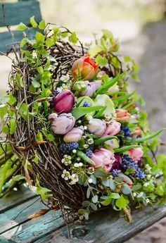 a bunch of flowers that are sitting on a bench